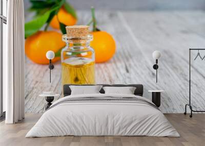 tangerine natural oil in bottle on white wooden rustic table Wall mural