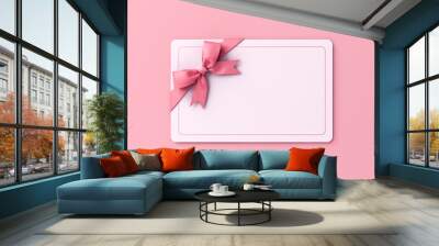 Blank sweet gift card or gift voucher with pink ribbon bow isolated on pink pastel color background with shadow minimal concept 3D rendering Wall mural