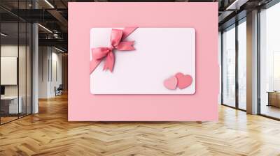 Blank Valentine gift card with pink ribbon bow and mini heart love couple isolated on pink pastel color wall background with shadow minimal conceptual 3D rendering Wall mural