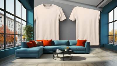 Two beige T-shirts one size on a one color background. Mock up. Blank for creating promotional products with prints and logo Wall mural