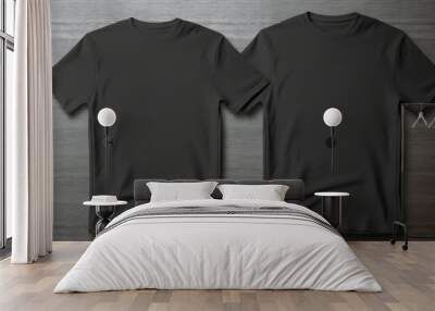 Two black T-shirts one size on a one color background. Mock up. Blank for creating promotional products with prints and logo Wall mural