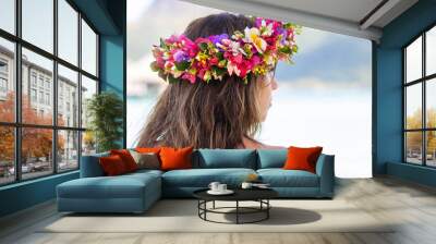 Beautiful woman wearing colorful flower crown while on a tropical island vacation in Bora Bora near Tahiti in French Polynesia Wall mural