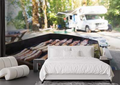 Breakfast cooking on a camp grill outside Wall mural