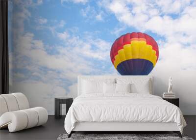 Colorful hot air balloon floating under blue sky Wall mural