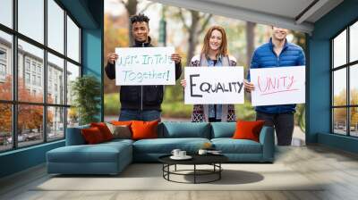 Group of five people holding signs with message of unity and equality Wall mural