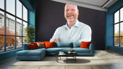 Portrait of friendly bald man with graying beard Wall mural