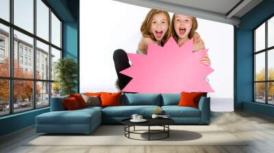 two enthusiastic girls holding a blank sign Wall mural