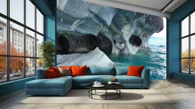 Clear waters of a lake and stunning eroding white Marble caves. Wall mural