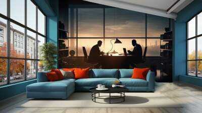 Two businessmen working in their office against window light. Silhouette with orange color. Wall mural