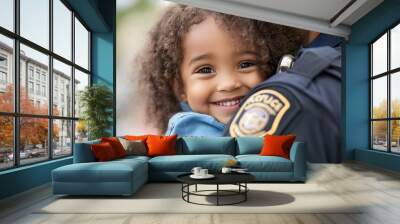 Child hugging policeman Wall mural