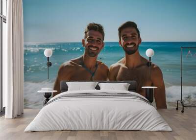 Two happy male friends standing on the beach  Wall mural