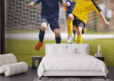 Boys Kick Football Ball on a Grass Field. Two Soccer Players in a Duel. Soccer Dribbling Moment During Youth Tournament Wall mural