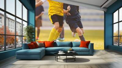 Football match at the stadium. Soccer players competing in summer sunlight. Wall mural