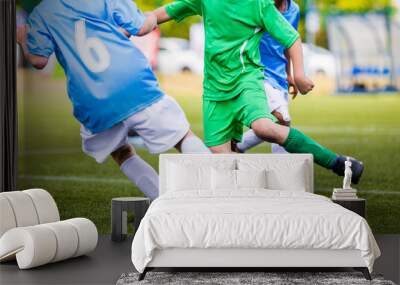 Soccer Football Match. Young Boys Kicking Football Ball on the Sports Field. Kids Playing Soccer Tournament Game on the Pitch Wall mural