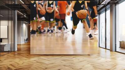 Youth Basketball Players in a Team on Training Drill. Young Boys Practice Basketball With Young Coach. Basketball Training Unit For Youth Players Wall mural