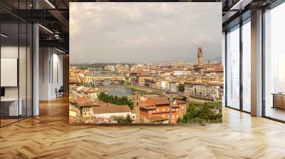 Cityscape of Florence, Italy. Beautiful view of Firenze with famous Ponte Vecchio bridge over the river Arno Wall mural