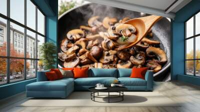 Sizzling Mushrooms in a Pan with a Wooden Spoon Wall mural