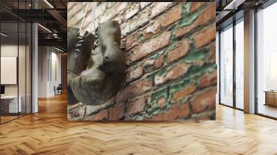 Old boxing gloves hang on nail on brick wall with copy space for text. High resolution 3d render Wall mural