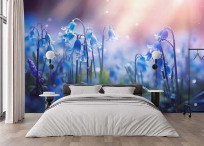 Photo of a field of vibrant blue flowers (bluebells) in a lush green grassy landscape Wall mural