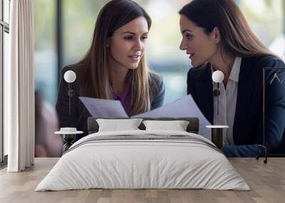 Two Businesswomen Discussing Documents in a Meeting Wall mural