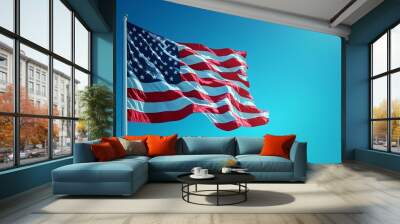 Vibrant American Flag Waving in Clear Blue Sky During Sunny Day Wall mural