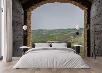 Amazing landscape of the vineyards of Langhe in Piemonte through a window. The wine route. An Unesco World Heritage. Natural contest. Rows of vineyards Wall mural