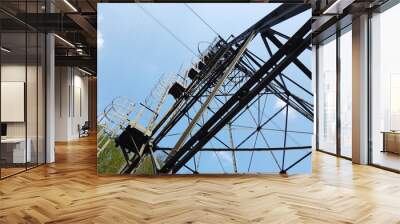 The pylon of the cableway that connects the towns of Albino and Selvino. Green painted pylons to camouflage them in the woods Wall mural