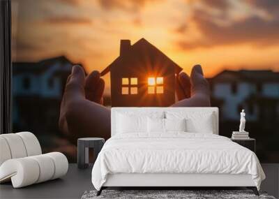 A conceptual background on home protection insurance, featuring hands holding a paper house Wall mural