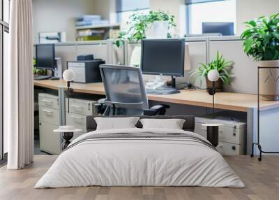 A cozy office cubicle setup with plants, computer monitor, and ergonomic chair showcasing a balanced work environment Wall mural