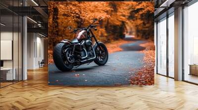 A motorcycle parked on a winding road surrounded by vibrant autumn foliage. Wall mural