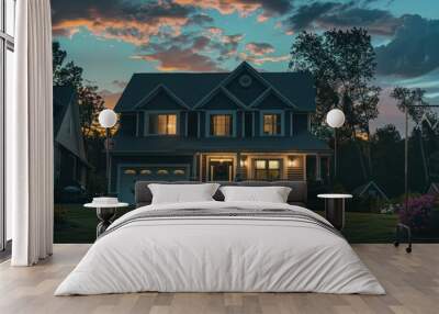 A well-maintained home with lit interior lies beneath a stunning sunset sky, highlighting suburban life Wall mural