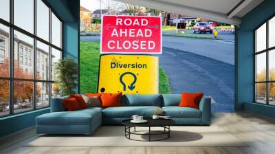 Road signs warning motorists of diverted traffic and road closures due to roadworks. Wall mural