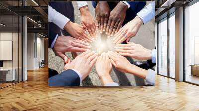 Hands, teamwork or top view of business people outside in collaboration for mission goals in city. Light, link or employees meeting with strategy, teamwork or support outdoors together in huddle Wall mural