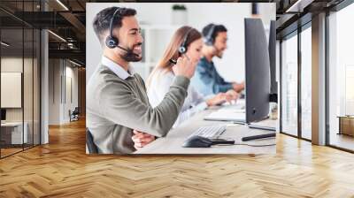 Man, call center and working in team office with headset, computer for online customer support, service or help. Businessman, employee and job in crm, telemarketing or communication help desk Wall mural