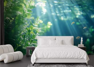 Underwater scene with sunlight filtering through water, illuminating aquatic plants and fish. Wall mural