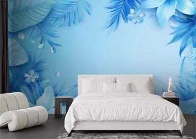 Vibrant blue tropical leaves and flowers with water drops create a beautiful frame on a light blue background Wall mural