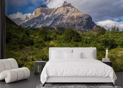 Woman hiking in Torres del Paine National Park with Los Cuernos and the Paine Massif behind, Patagonia, Chile, South America Wall mural