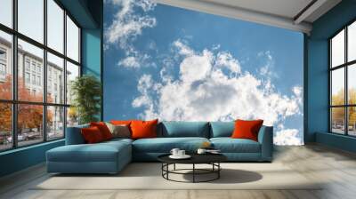 A low angle shot of a beautiful cloudscape on a blue sky background Wall mural