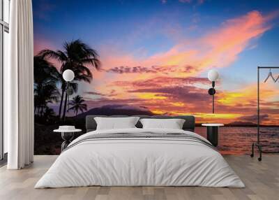 Sunset in yellow and purple shades with a reflection in the sea, Puerto Plata, Dominican Republic, Caribbean. Wall mural