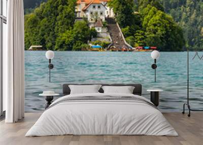 Panoramic view from Lake Bled, beauty heritage in Slovenia. Island with church and castle in the background create a dream setting. View from Ojstrica and Mala Osojnica with the heart-shaped bench. Wall mural