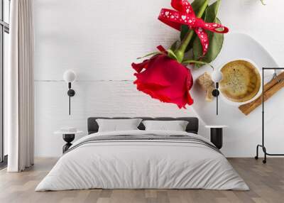 Cup of coffee, red rose, sugar and cinnamon on a white wooden ba Wall mural