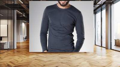 attractive sexy man with beard dressed casual smiling Wall mural