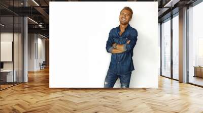 Stylish man digital portrait in casual attire on white background, smiling with crossed arms Wall mural