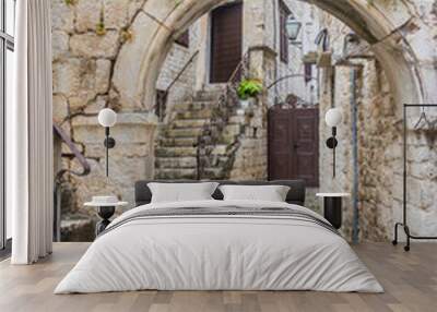 Narrow alley and stone houses in Trogir, Croatia Wall mural