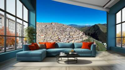 180 degree photo of the typical village of Gangi with a view of the Etna volcano. Typical Sicilian village. Nature on the Madonie in winter. Wheat fields. Wall mural