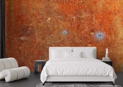 A rough orange background wall with two very small spider webs Wall mural