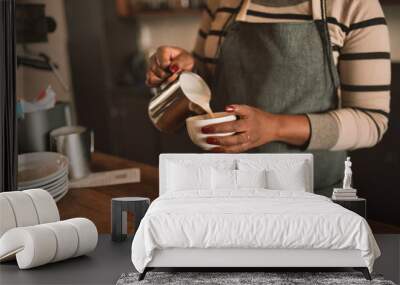 Closeup of an African barista making a cup of cappuccino Wall mural