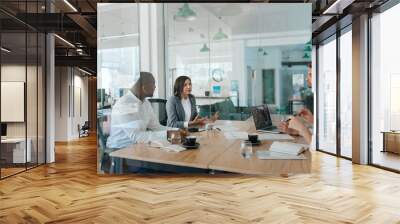 Diverse group of businesspeople talking together inside of an office Wall mural