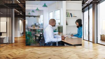 Manager interviewing a potential new employee in her office Wall mural