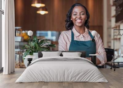 smiling african entrepreneur standing at the counter of her cafe Wall mural